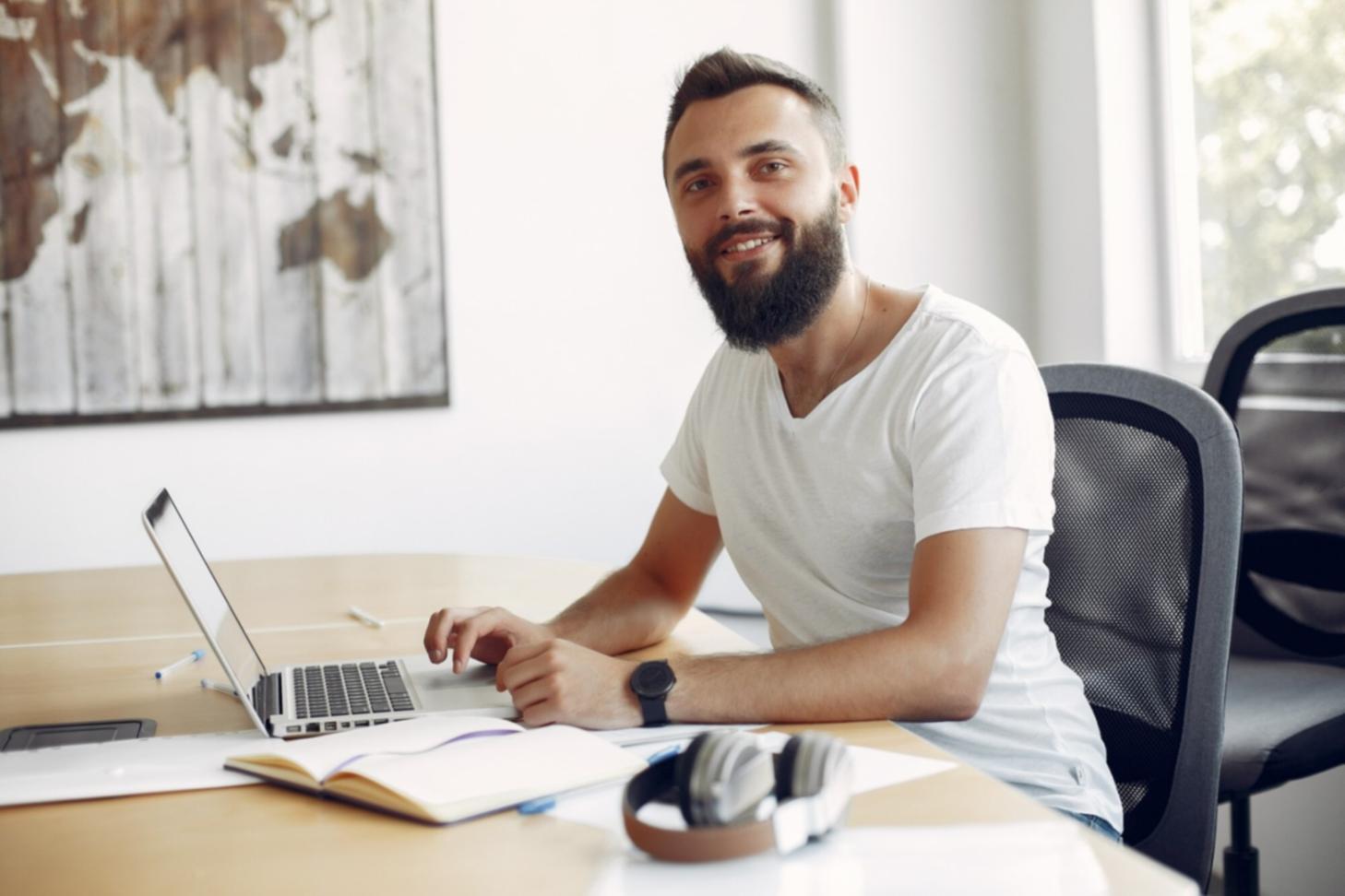 Modern workspace with multiple monitors showing development environment